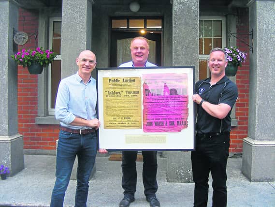 L/R: Paul Walsh, Ronan Loughnane, and Mark Cullinane, pictured with copies of the ads for the public auction of St Mary’s Rectory