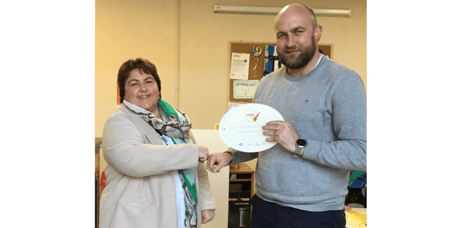 Joanne McCormack, Chairperson of the H.P. committee, receiving the award from Kevin O'Driscoll, National Youth Council of Ireland