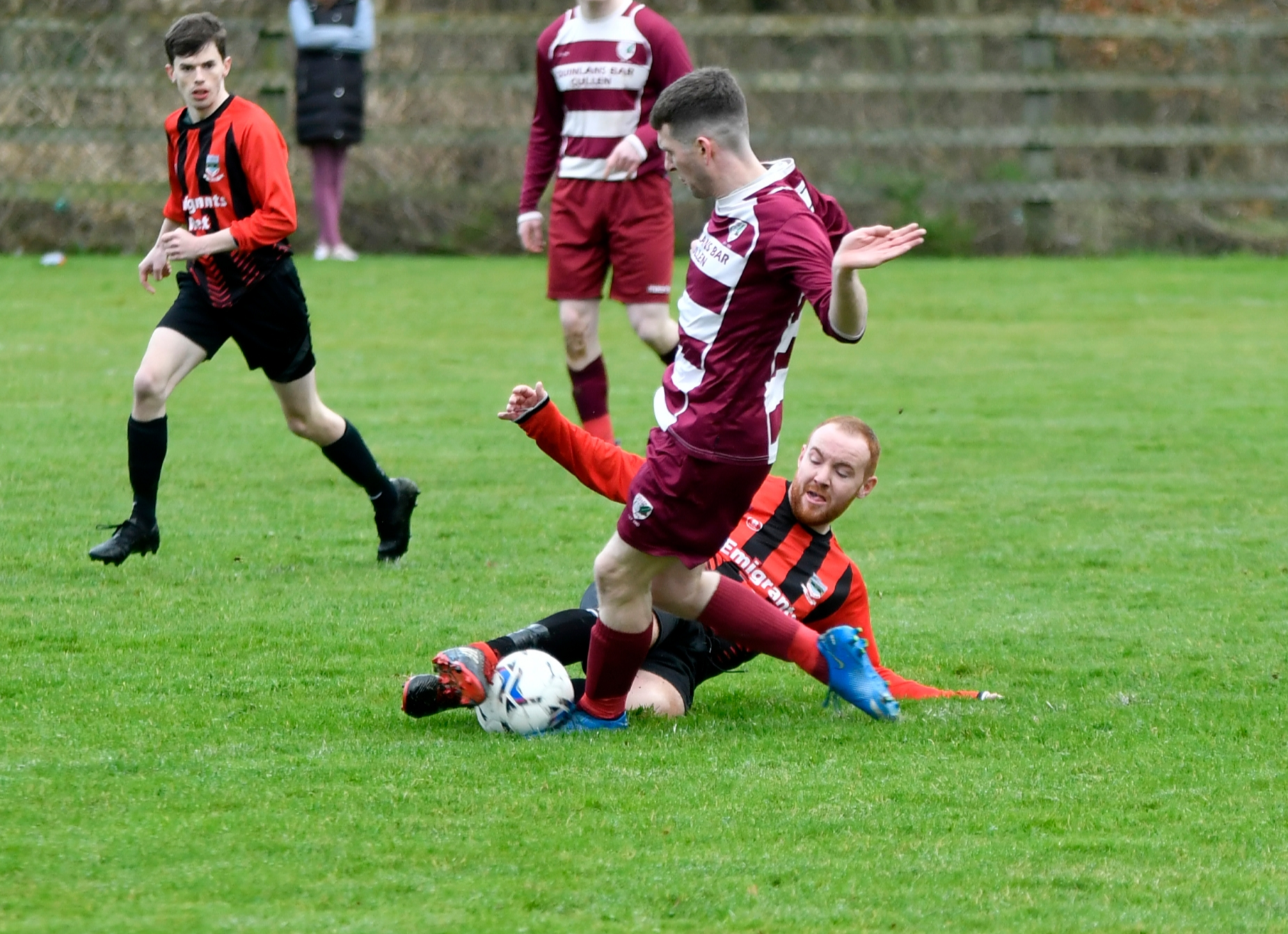 Action from last Sunday's Division 1 game at Green Lane, Clonmel. Cullen/Lattin's Brendan O'Sullivan is tackled by Andrew Pyke, Old Bridge. Jack Kennedy (OB) watches on.