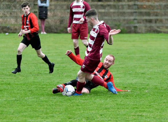 Action from last Sunday's Division 1 game at Green Lane, Clonmel. Cullen/Lattin's Brendan O'Sullivan is tackled by Andrew Pyke, Old Bridge. Jack Kennedy (OB) watches on.