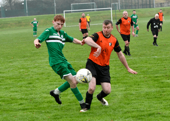 Clonmel Celtic’s Sean Hawkins and Kilsheelan United’s JP Peters battle for possession in Sunday's Division 2 League game at the By-Pass in Clonmel.