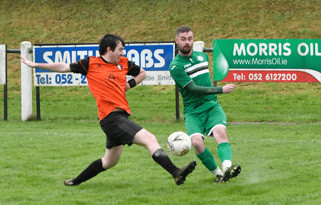 Clonmel Celtic's Damon Gregory gets his cross in ahead of Kilsheelan United's Conor Murphy's challenge in Sunday's Division 2 League game at the By-Pass in Clonmel. Pic: Michael Boland.
