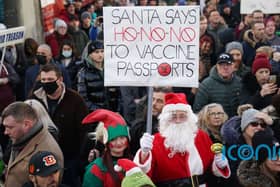 Protesters take to the streets of Belfast over introduction of vaccine passports