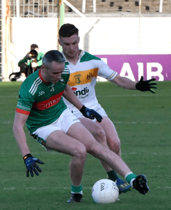 Loughmore captain Willie Eviston is about to be tackled by Clonmel Commercials’ Jason Lonergan at Semple Stadium during the county senior football championship final. Picture: Michael Boland