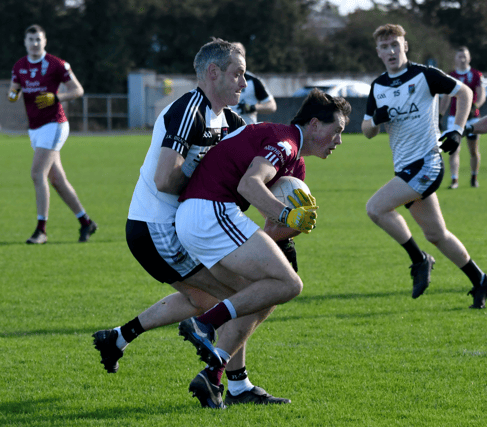 Ardfinnan's Gavin Whelan holds on to possession despite the strong challenge of Lorcan Egan (JK Brackens) in Sunday's County SFC quarter-final encounter played at Golden. pic: michael boland