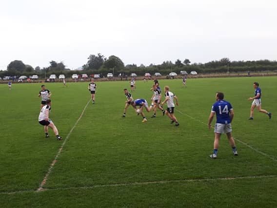 Action from the FBD Insurance county senior football championship this evening in Holycross