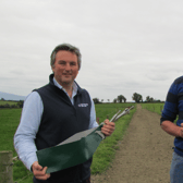 James Maloney, Enterprise Ireland, holding the Calving Assist product, with Cashel farmer James Ryan (right)