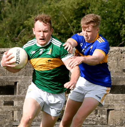 Kilsheelan Kilcash's Billy O'Connor tackles Moyne Templetuohy's Tom Meade during the county senior football championship game in Cashel. Picture: Michael Boland