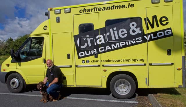 Aaron Burchael with his Cocker Spaniel Charlie at their new camper van which was formerly a HSE ambulance