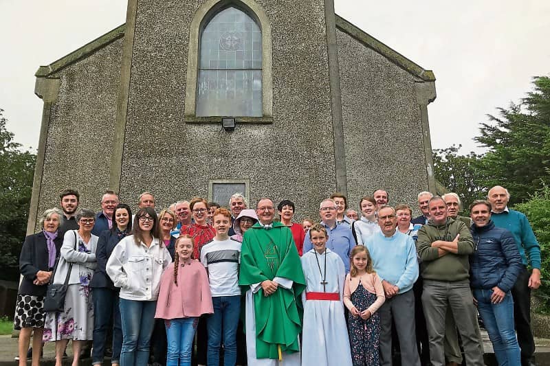 Pictured here were the congregation at Knockgraffon Mass last Sunday with Fr Michael Kennedy who is leaving the parish of New Inn after 12 years of dedicated service.