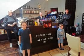 Flanagan’s Lane Restaurant – new owners Niamh Quinn McIlveney (left) and Gary McIlveney with their children Harper and Zach and waitress  Bridget Keogh