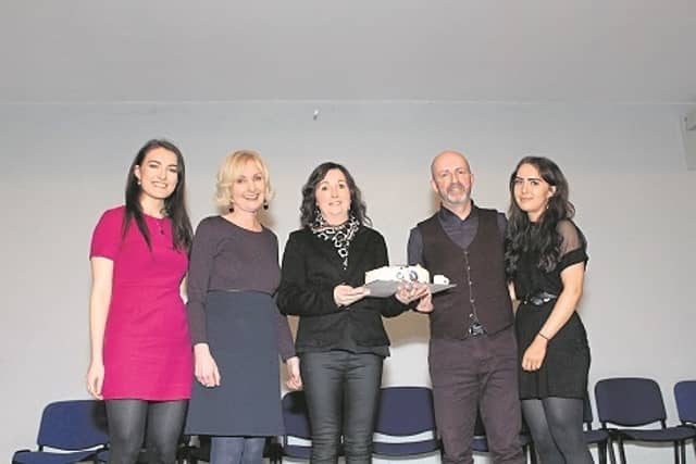 Christy Clancy pictured with members of his family including his wife Ailish, receiving a presentation to mark his retirement recently