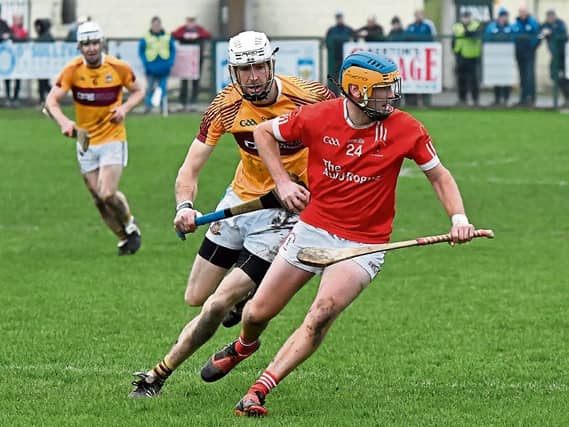 Carrick Davins midfielder Michael Ryan gets away from Kevin Sheehan (St Mary's) in today's Munster Junior Hurling Champions semi-final played at Clonmel. Picture: Michael Boland.