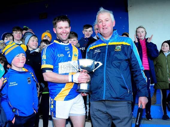 County Board chairman John Devane pictured presenting the cup to Boherlahan-Dualla captain Johnny Maher following the 2018 county junior A hurling final at New Inn. Photo: Eamonn McGee