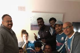 Renne Abraham,United Cricket Clonmel presents a team jersey to Emma  Lacey who is now an honorary member of the club.Also included are members of the UCC and supporters.