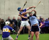 Reaching for the skies: Kiladangan's Joe Gallagher and Nenagh Éire Óg's Paddy Murphy pictured contesting a dropping ball watched by Jack Loughnane at Templederry on Saturday.  Photo: Bridget Delaney