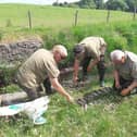 Inland Fisheries officers asses a situation