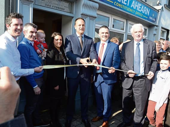 Taoiseach Leo Varadkar cutting the tape to offically open Garret Ahearn's Constituency Office in Cahir. With him is Garret Ahearn and some of his immediate family. Photo: Seamus Bourke.