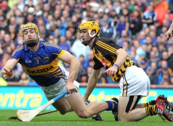 Padraic Maher in action against Colin Fennelly.
