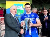 Thurles Sarsfields captain Pádraic Maher pictured accepting the Dan Breen Cup from County Board chairman Michael Bourke. Photo: Eamonn McGee