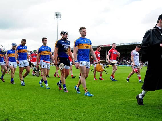 Captain Pádraic Maher pictured leading Tipperary through the pre-match parade against Cork.