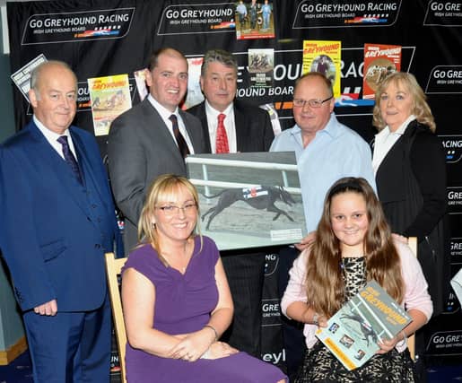 Paul Keogh (TD & Minister with responsibility for Defence) pictured making a Presentation to personality of the year Graham Holland.