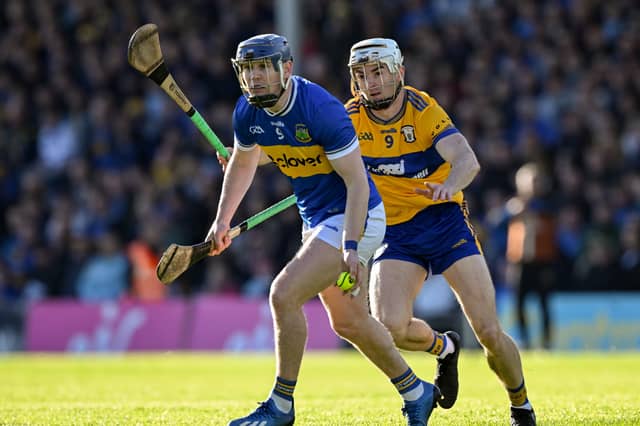 Tipperary's Alan Tynan is about to be tackled by Clare's Ryan Taylor during this evening's match at FBD Semple Stadium