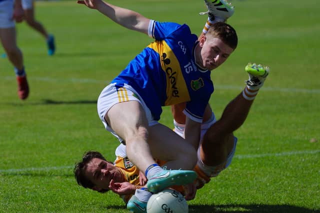Tipperary's Daithí Hogan tangles with an Antrim opponent during Sunday's match at Corrigan Park, Belfast
