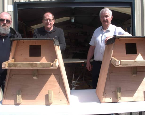 Two barn owl nesting boxes constructed by Carrick-on-Suir Men's Shed members Damian McNamara (left) and Pat Callanan (right) are donated to Edmond Coady (centre) of Ahenny Clashnasmuth Faugheen Tidy Towns Group 