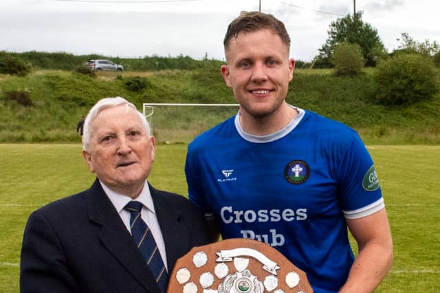 Benny Tynan, Chairman of the Tipperary Southern and District soccer League, presents the Division 3 Shield to Donohill captain Dinny Crosse