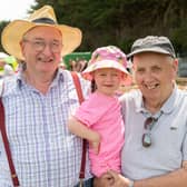 Pretty in pink Sophie Pyke with her grandads, Tom Delahunty and Sean Pyke at the Clonmel show.