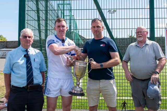 St Mary's captain Seamus Kennedy receives the cup from Ciaran Gahan, representing sponsors Clonmel Oil. Also included are South Tipperary GAA Chairman Nicholas Moroney (left) and Secretary John Lonergan