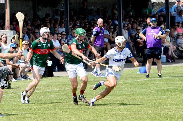 Tadgh Condon, St Mary's, tries to get away from Mullinahone's Cillian White during the South Tipperary Senior Hurling Championship final