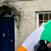 Roscrea Garda Station and a protester during one of the protests held outside the Station in the last few years.
