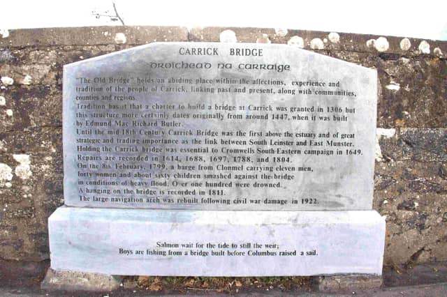 The partially cleaned plaque on Carrick-on-Suir's Old Bridge that was defaced by vandals last week.