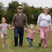 The Lamb family in one of their fields with their EasyCare sheep grazing behind them. 