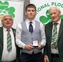 James O'Brien from Tipperary South is presented with a bronze medal for Under 21 Conventional Junior by NPA chairman John Deery and NPA president Mick Mahon