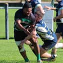 Jason Monua plays a pass for Clonmel when they beat Dolphin