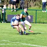 Brian McKeown, Moyle Rovers (left) and Cian Smith, Clonmel Commercials, in action during the County Senior Football Championship semi-final 
