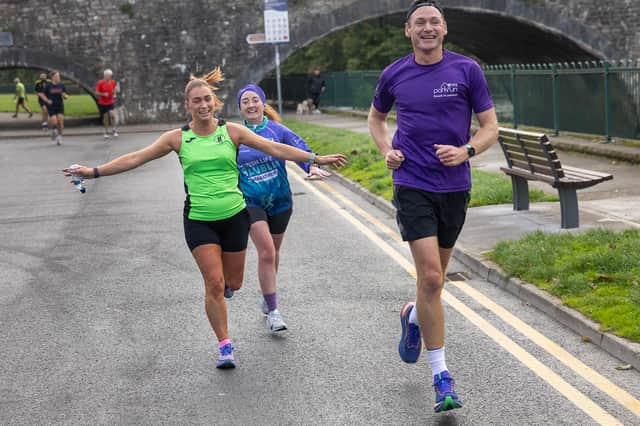 David Gillick finishing with Caroline O'Donoghue and Adele Hall in the VHI 5k parkrun in Clonmel