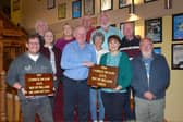 Former owner of The Munster Bar in Waterford Peter Fitzgerald (centre in blue shirt) presenting the plaques. From left: Caolán Deehy-Power, Louise Russell, Ray Nolan, Siobhán Grace-Regan, Peter Fitzgerald, Breda Butler, Michael O'Hara, Liam Butler, Sandra Power, Martin Morrissey, Padraig Sheehan
