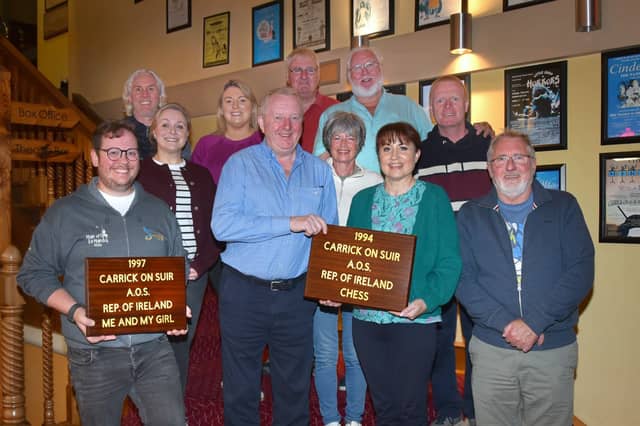 Former owner of The Munster Bar in Waterford Peter Fitzgerald (centre in blue shirt) presenting the plaques. From left: Caolán Deehy-Power, Louise Russell, Ray Nolan, Siobhán Grace-Regan, Peter Fitzgerald, Breda Butler, Michael O'Hara, Liam Butler, Sandra Power, Martin Morrissey, Padraig Sheehan