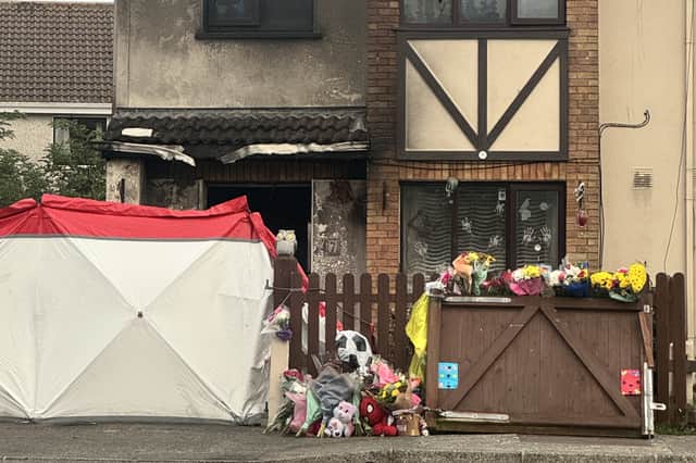 Floral tributes at a house in Birchwood, Waterford 