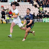 Tadhg Sheehan, Clonmel Commercials (left) in action against Loughmore/Castleiney's Ed Connolly during Sunday's FBD Insurance County Senior Football Championship final