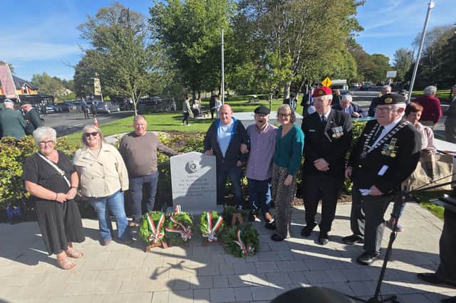 Members of the late Private James Coady's family standing at the restored memorial at Bunratty with Stephen Kelly (wearing red beret) of the Private James Coady Bunratty Memorial Project Group and another Defence Forces veteran.