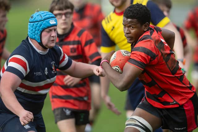 Mbekezeli Masuku makes a break for Clonmel High School's Under 19s against Villiers School