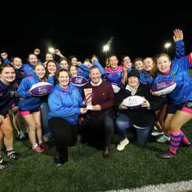 Celebration: Brendan Cummins presenting a trophy to Fethard & District Rugby Football Club (RFC), the Irish winner of Royal London’s Championing Women’s and Girls’ Rugby Award. Also in the photo are Mary Gorey, Club Registrar, Sarah Johnston,  Honorary Secretary of the club  and U18 players with Fethard & District RFC