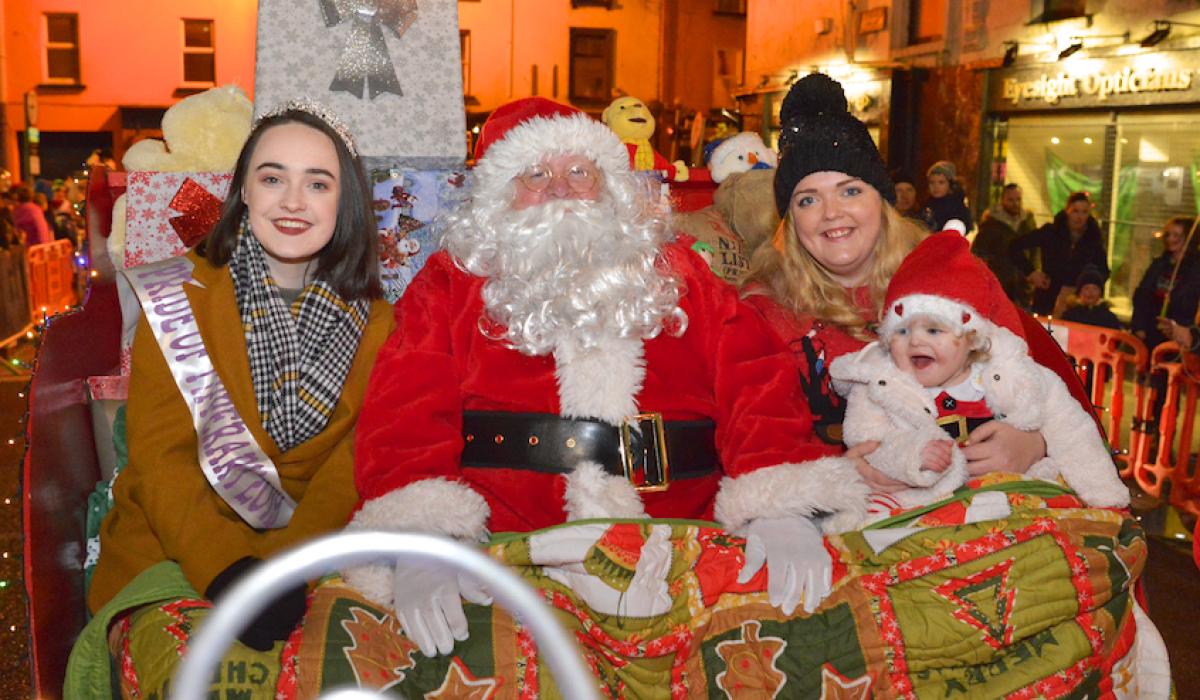 Eve and Muireann help Santa turn on Christmas lights in Tipperary Town