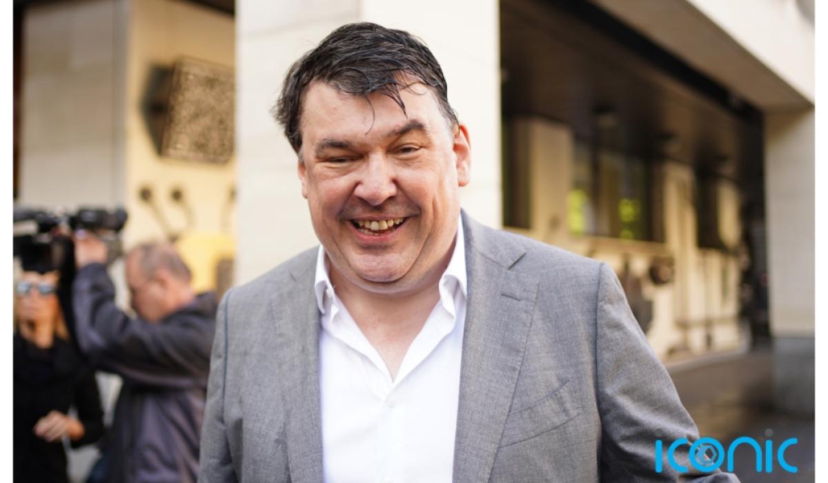 Father Ted creator arrives at court for trial of alleged harassment of