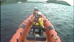 Lough Derg RNLI  assist passengers on a 40ft cruiser ran aground by Hare Island